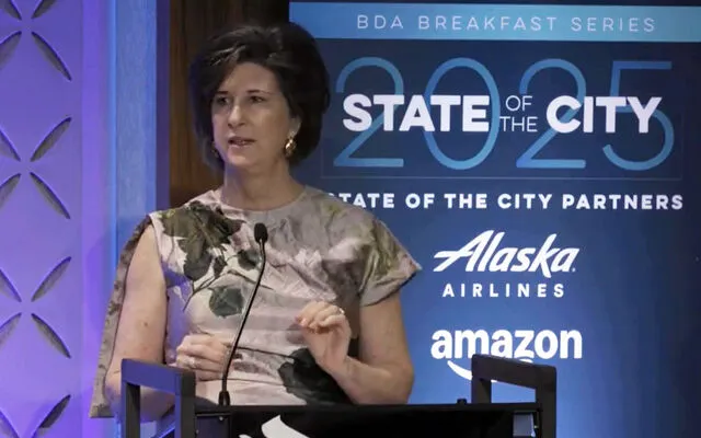 Mayor Lynne Robinson speaks at a podium.