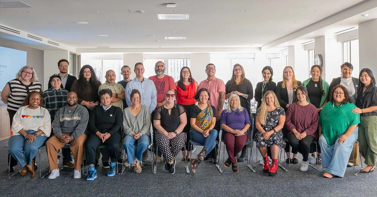 A group of individuals gather for a photo at the Inatai office Seattle.