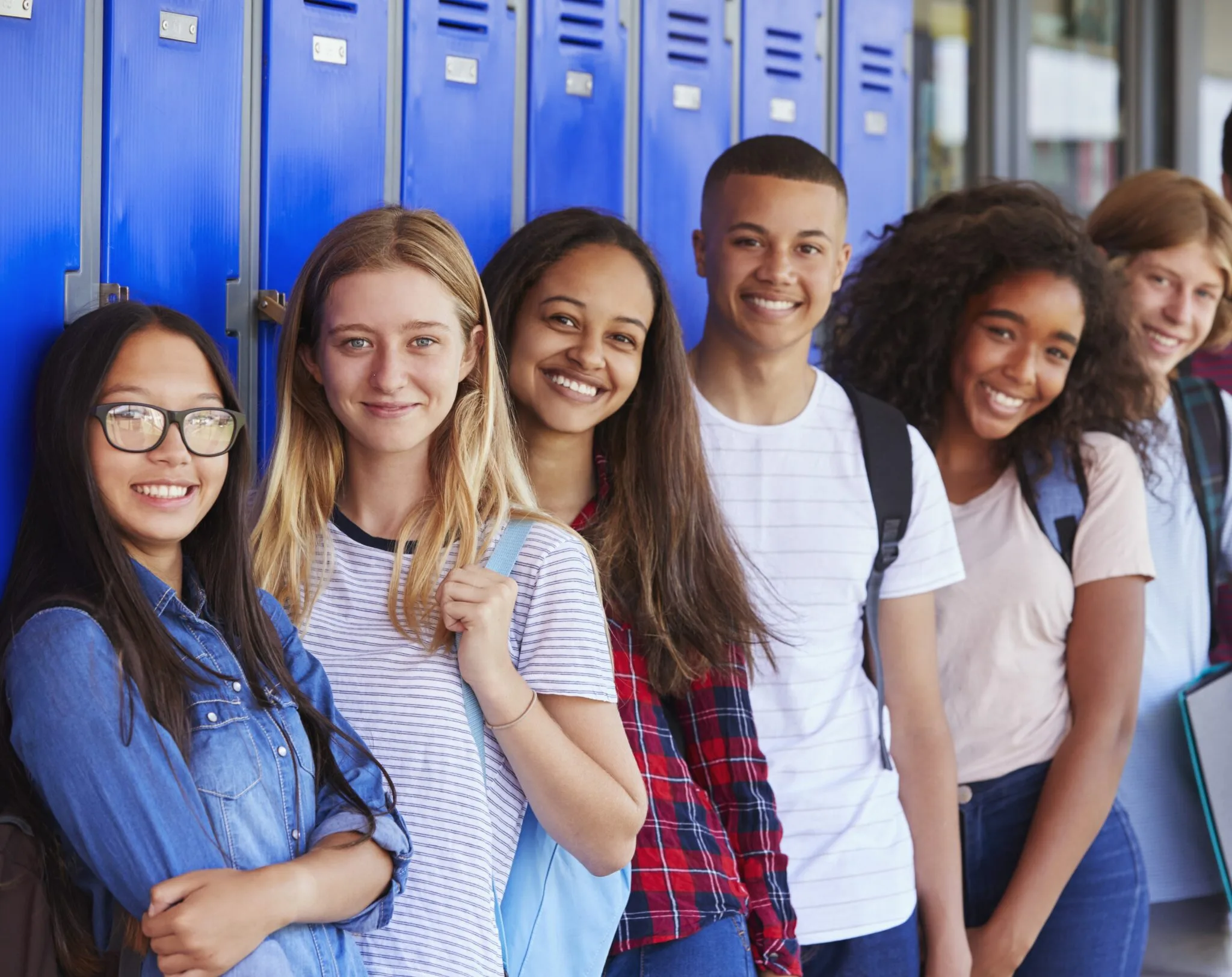 Two youth picking out school supplies at the free event